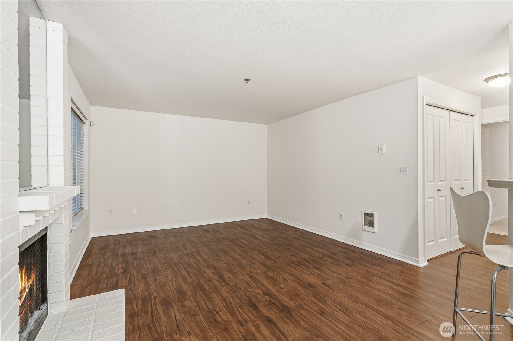 11527 Highway 99, Unit C106 Everett, WA 98204 - Photo 14 of 21 a view of empty room with wooden floor and fan