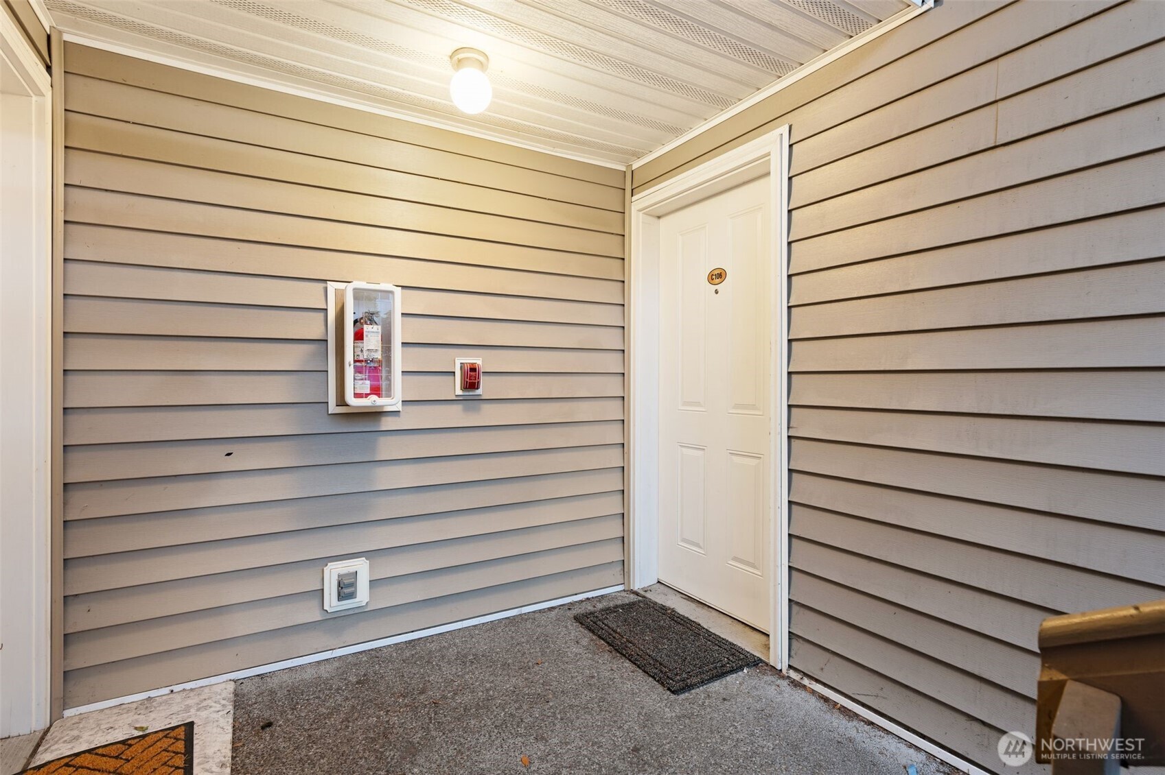 11527 Highway 99, Unit C106 Everett, WA 98204 - Photo 18 of 21 a view of a door and an outdoor space