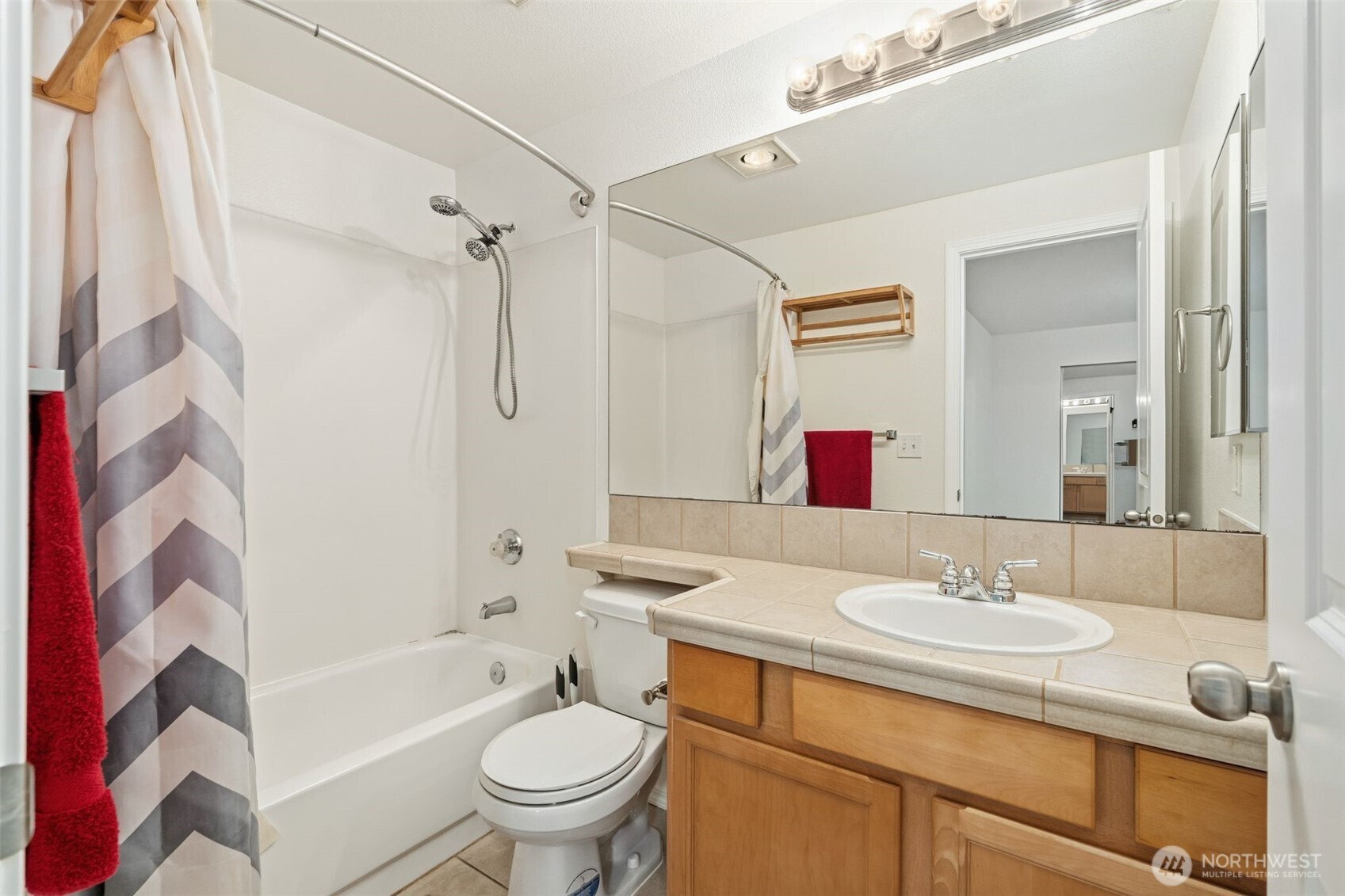11527 Highway 99, Unit C106 Everett, WA 98204 - Photo 6 of 21 a bathroom with a granite countertop sink toilet and shower