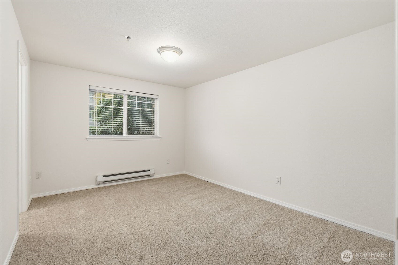 11527 Highway 99, Unit C106 Everett, WA 98204 - Photo 7 of 21 an empty room with windows