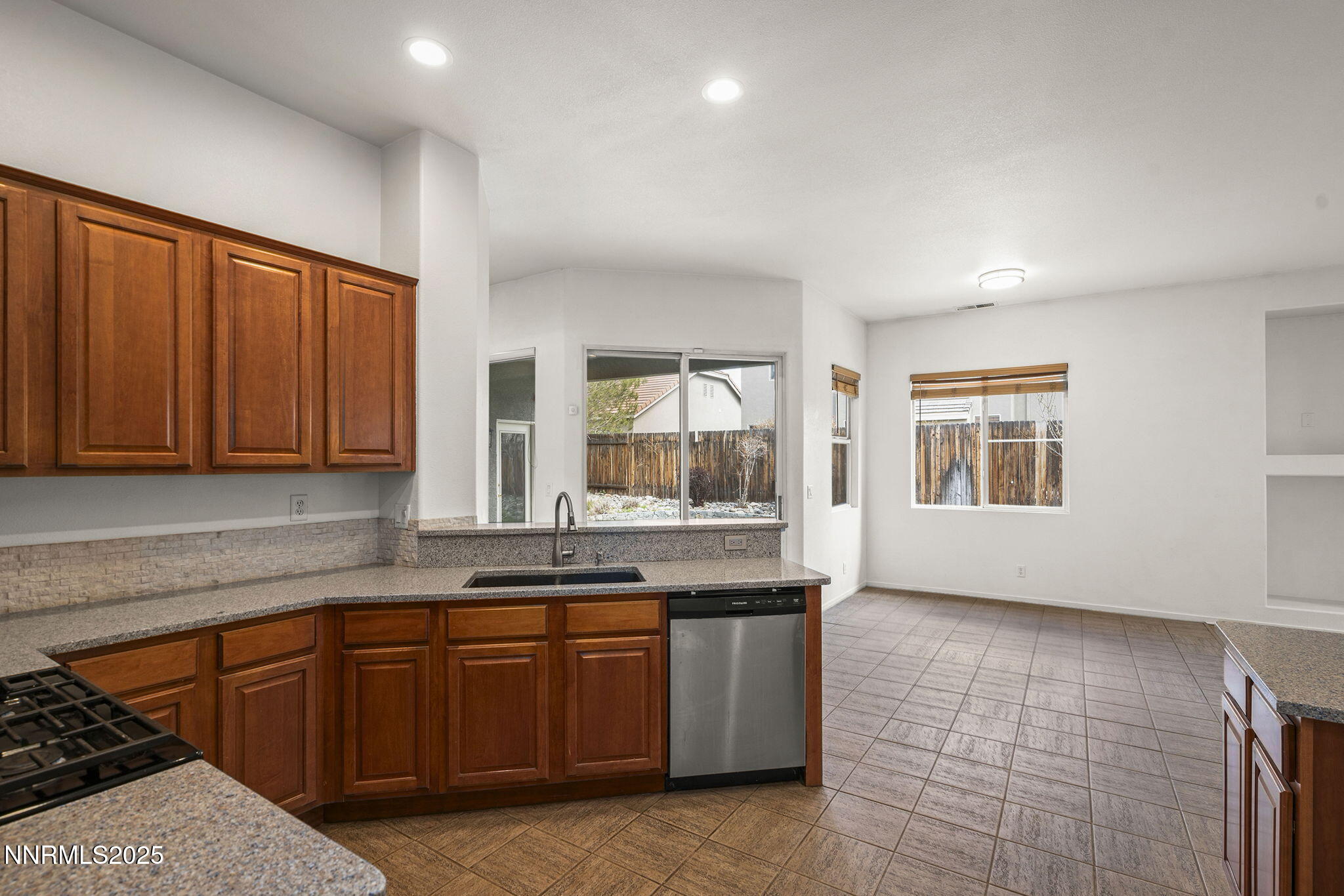 10452 Copper Wood Court Reno, NV 89521 - Photo 18 of 30 a kitchen with granite countertop a sink and cabinets