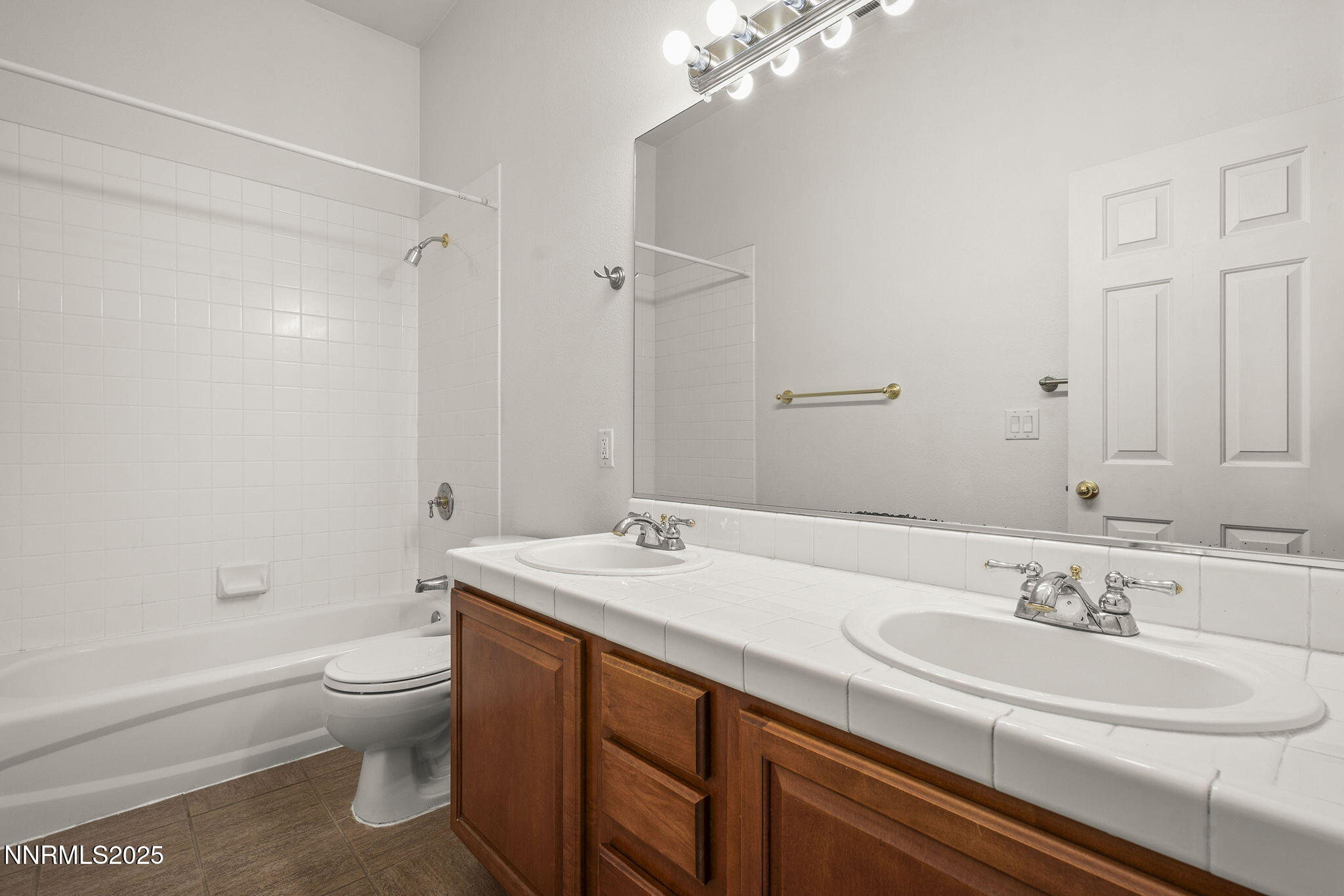 10452 Copper Wood Court Reno, NV 89521 - Photo 27 of 30 a bathroom with a sink a toilet and shower