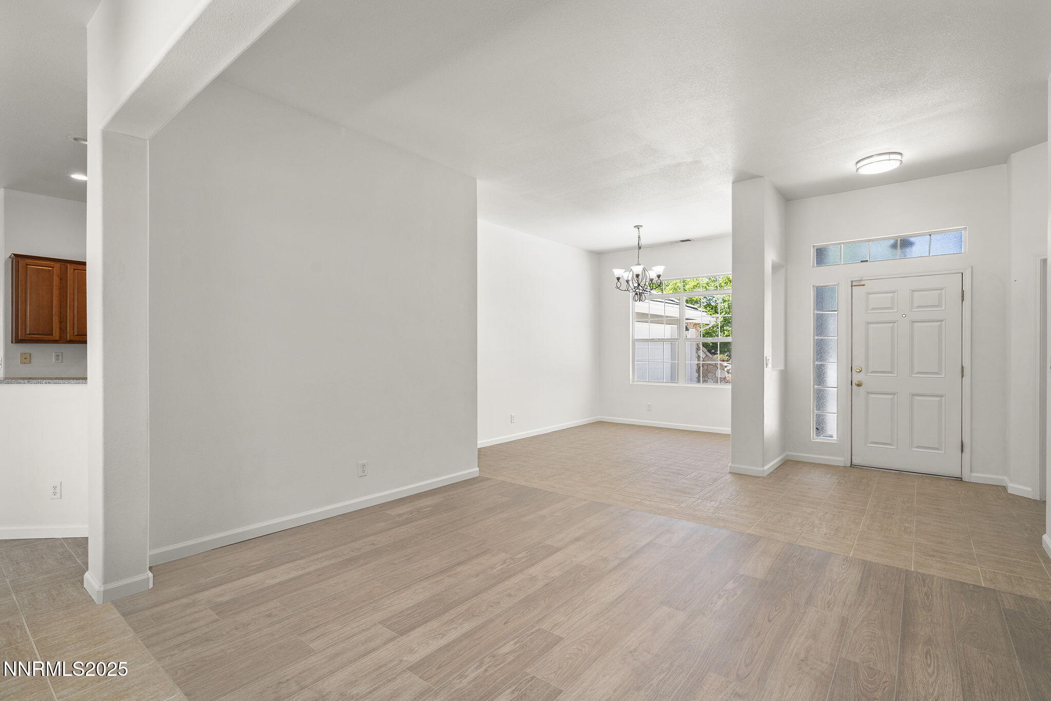 10452 Copper Wood Court Reno, NV 89521 - Photo 6 of 30 a view of empty room with wooden floor