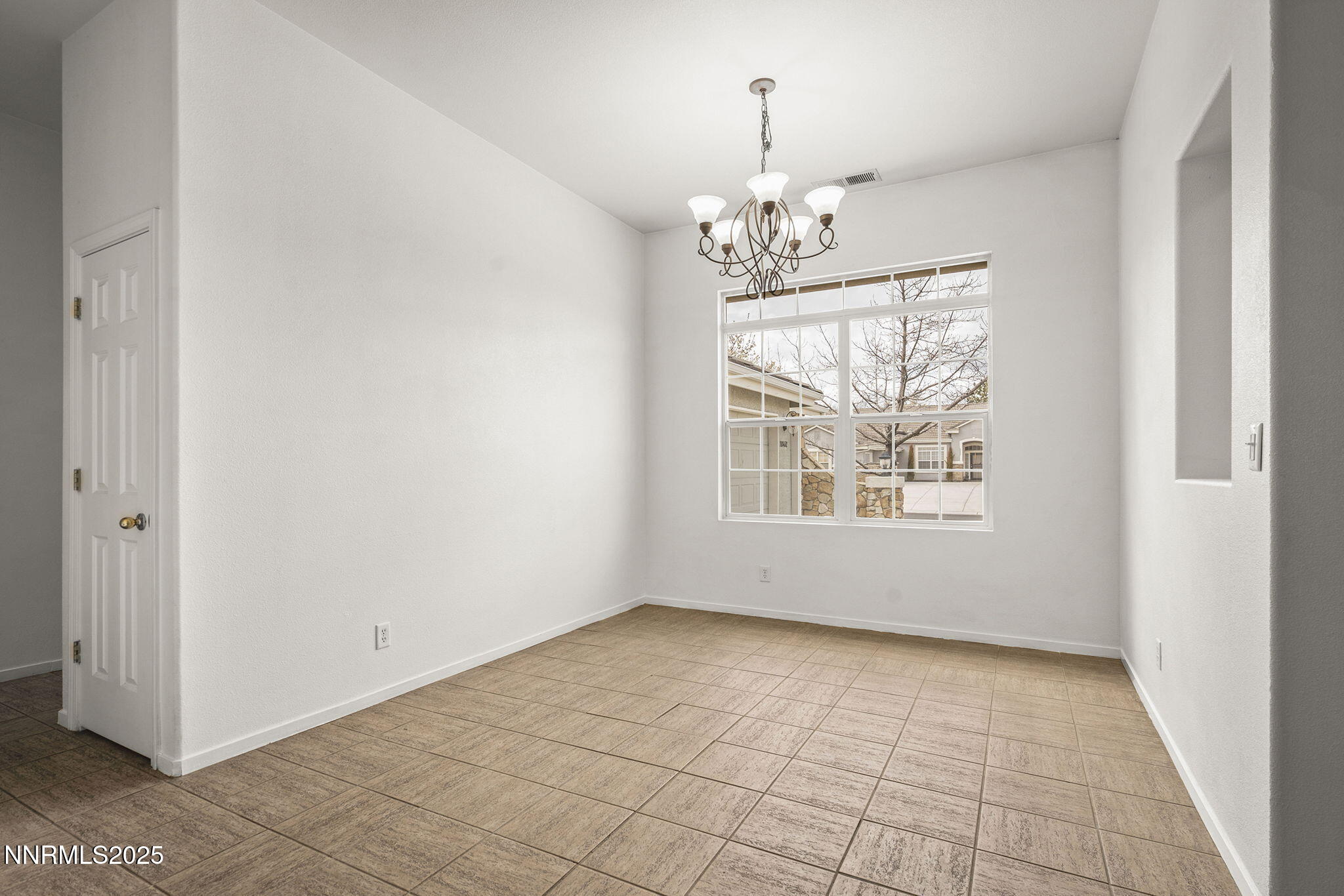 10452 Copper Wood Court Reno, NV 89521 - Photo 8 of 30 a view of an empty room with a window
