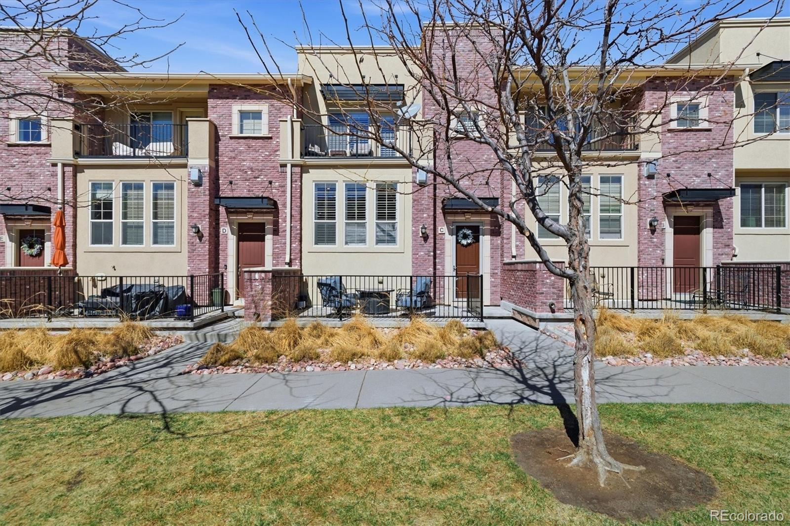 950 Elmhurst Drive, Unit C Highlands Ranch, CO 80129 - Photo 1 of 31 a view of an house with backyard and sitting area