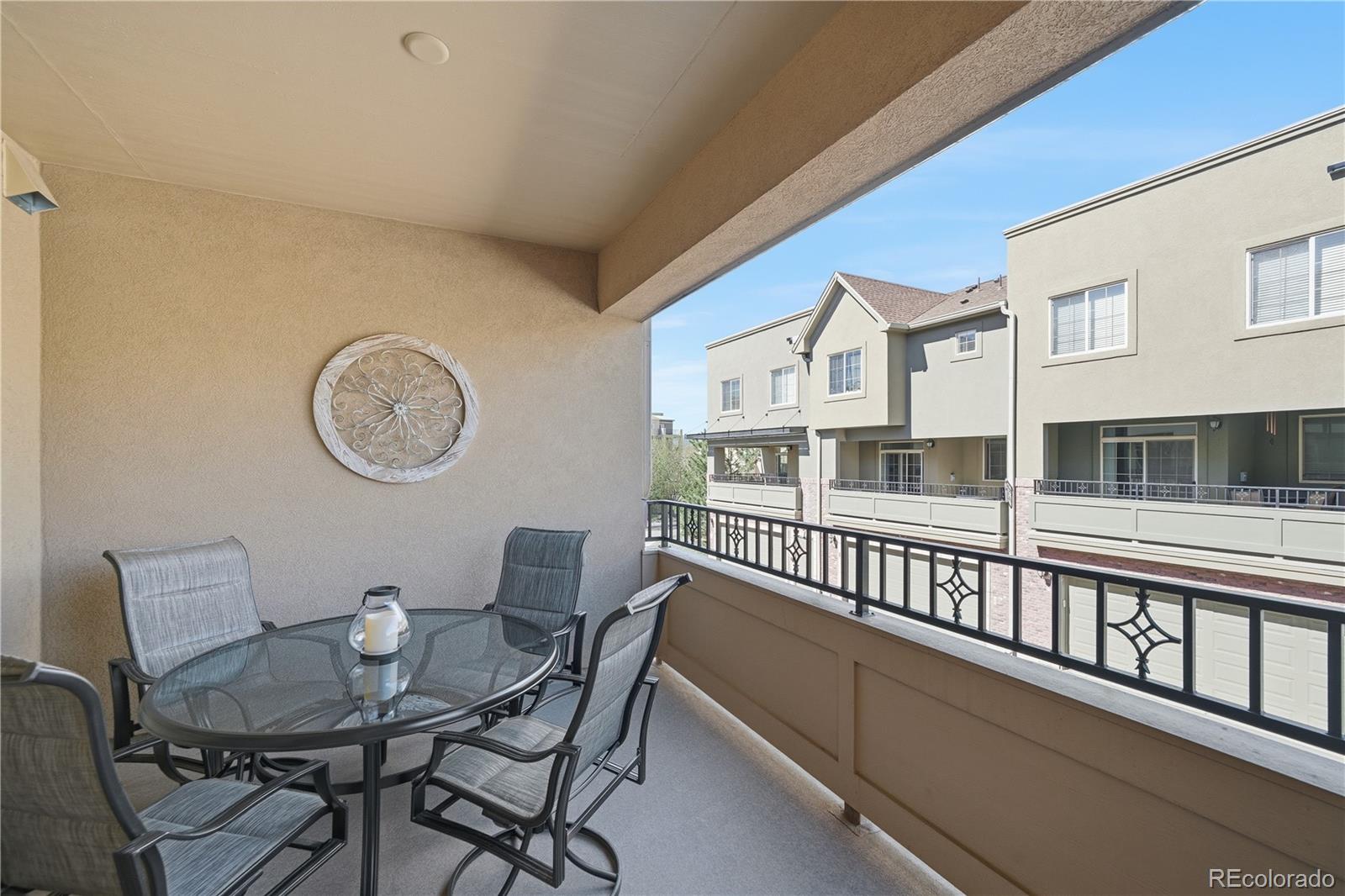 950 Elmhurst Drive, Unit C Highlands Ranch, CO 80129 - Photo 11 of 31 a view of a dining room with furniture and a large window