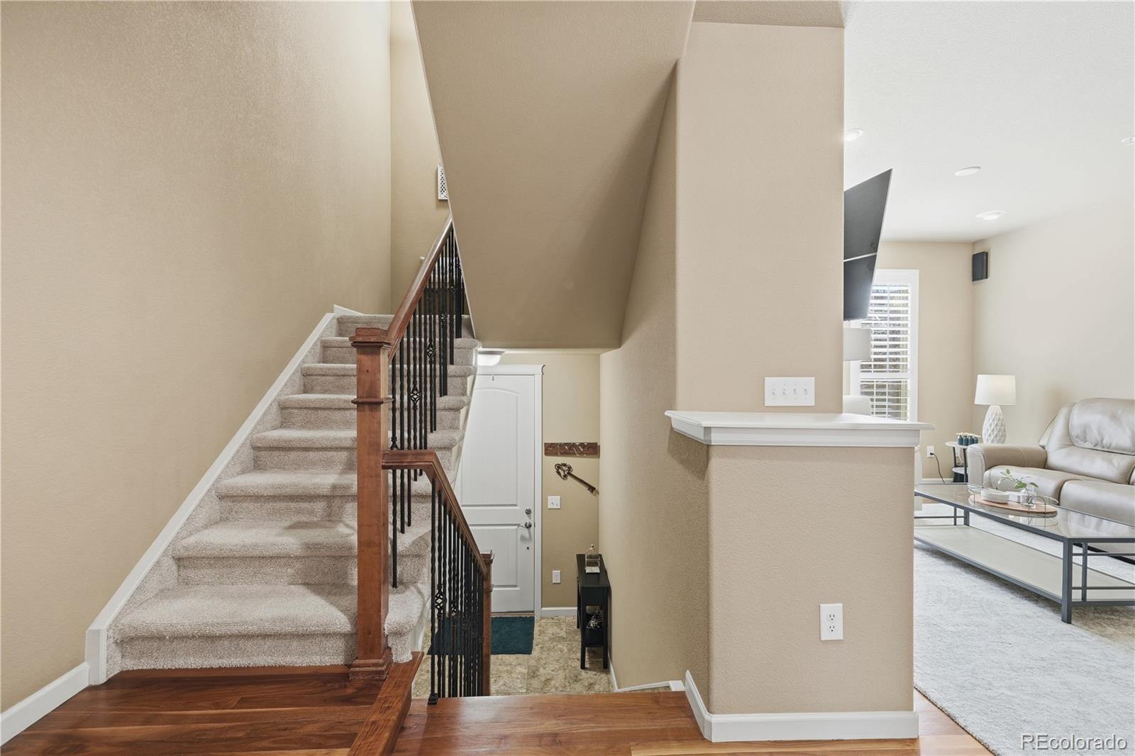 950 Elmhurst Drive, Unit C Highlands Ranch, CO 80129 - Photo 13 of 31 a view of entryway and hall with wooden floor