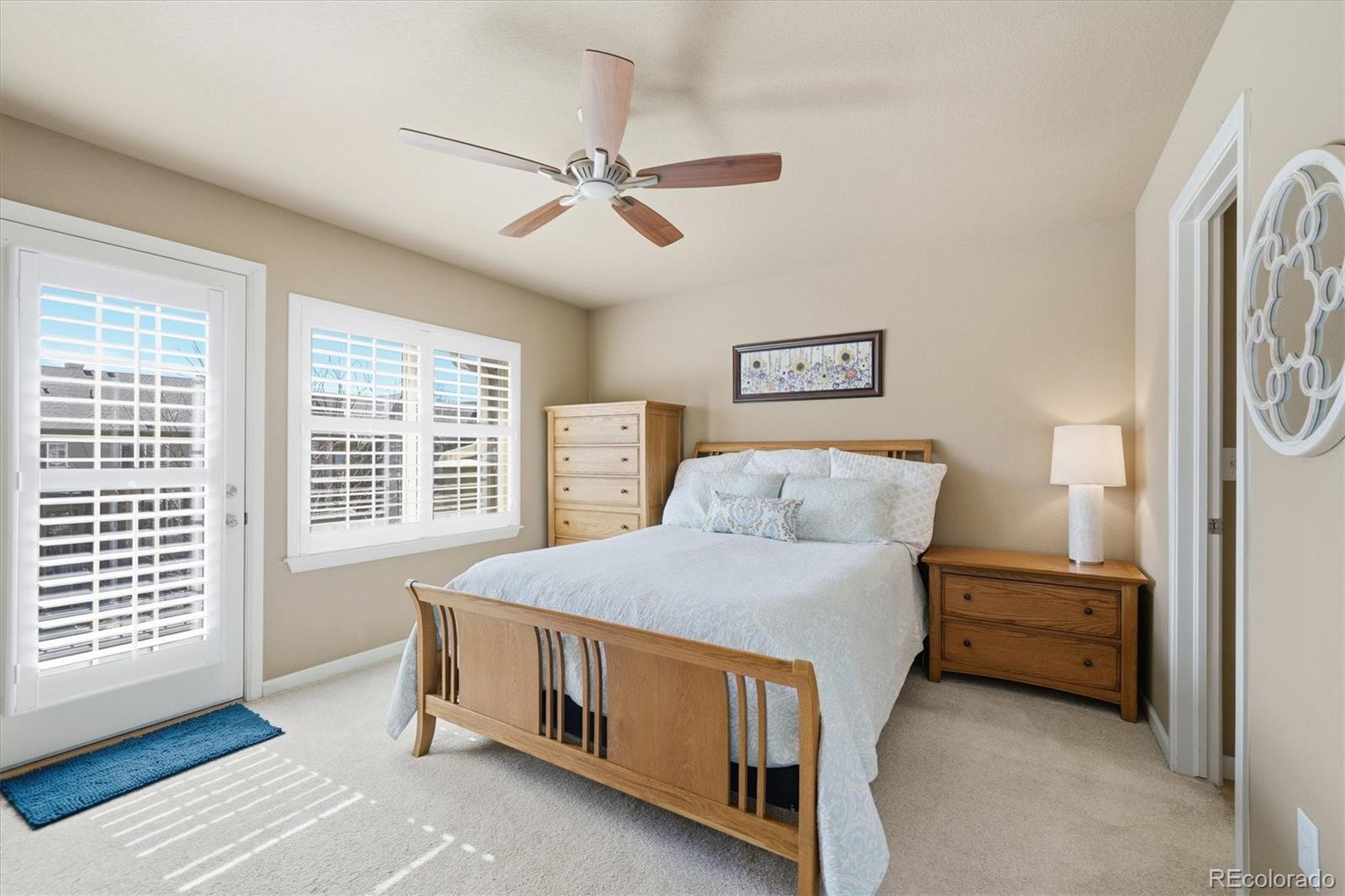 950 Elmhurst Drive, Unit C Highlands Ranch, CO 80129 - Photo 15 of 31 a bed room with a bed and a window
