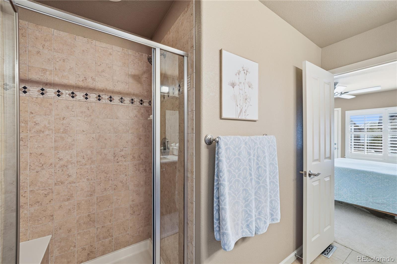 950 Elmhurst Drive, Unit C Highlands Ranch, CO 80129 - Photo 19 of 31 a bathroom with a shower