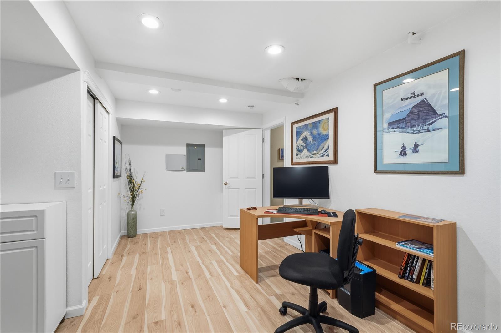 950 Elmhurst Drive, Unit C Highlands Ranch, CO 80129 - Photo 25 of 31 a workspace with furniture and wooden floor