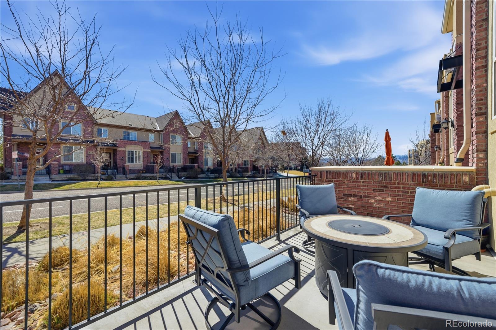 950 Elmhurst Drive, Unit C Highlands Ranch, CO 80129 - Photo 3 of 31 a view of a patio with couches chairs and a fire pit