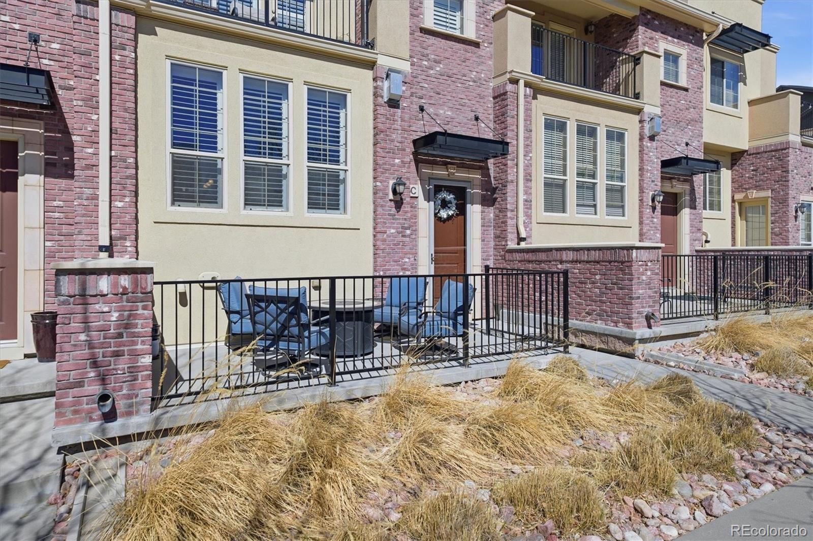 950 Elmhurst Drive, Unit C Highlands Ranch, CO 80129 - Photo 4 of 31 a house view with a outdoor space