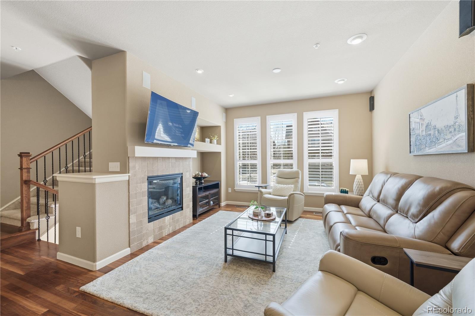 950 Elmhurst Drive, Unit C Highlands Ranch, CO 80129 - Photo 5 of 31 a living room with furniture and a fireplace
