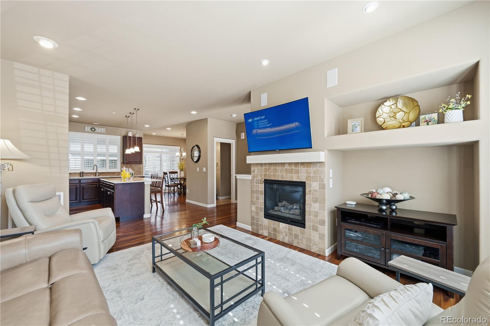 950 Elmhurst Drive, Unit C Highlands Ranch, CO 80129 - Photo 7 of 31 a living room with furniture and a fireplace