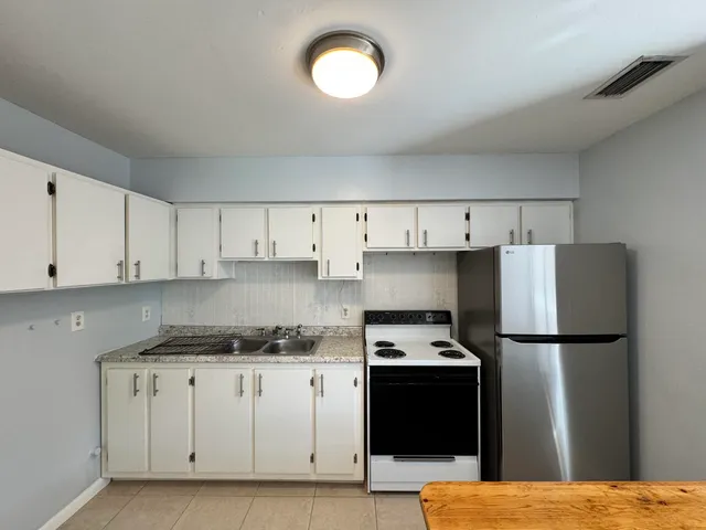 a view of an empty room with a window