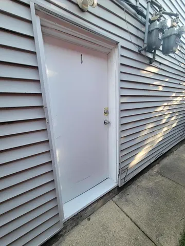 a view of a room with stairs and a window