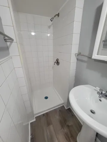 a bathroom with a sink and shower