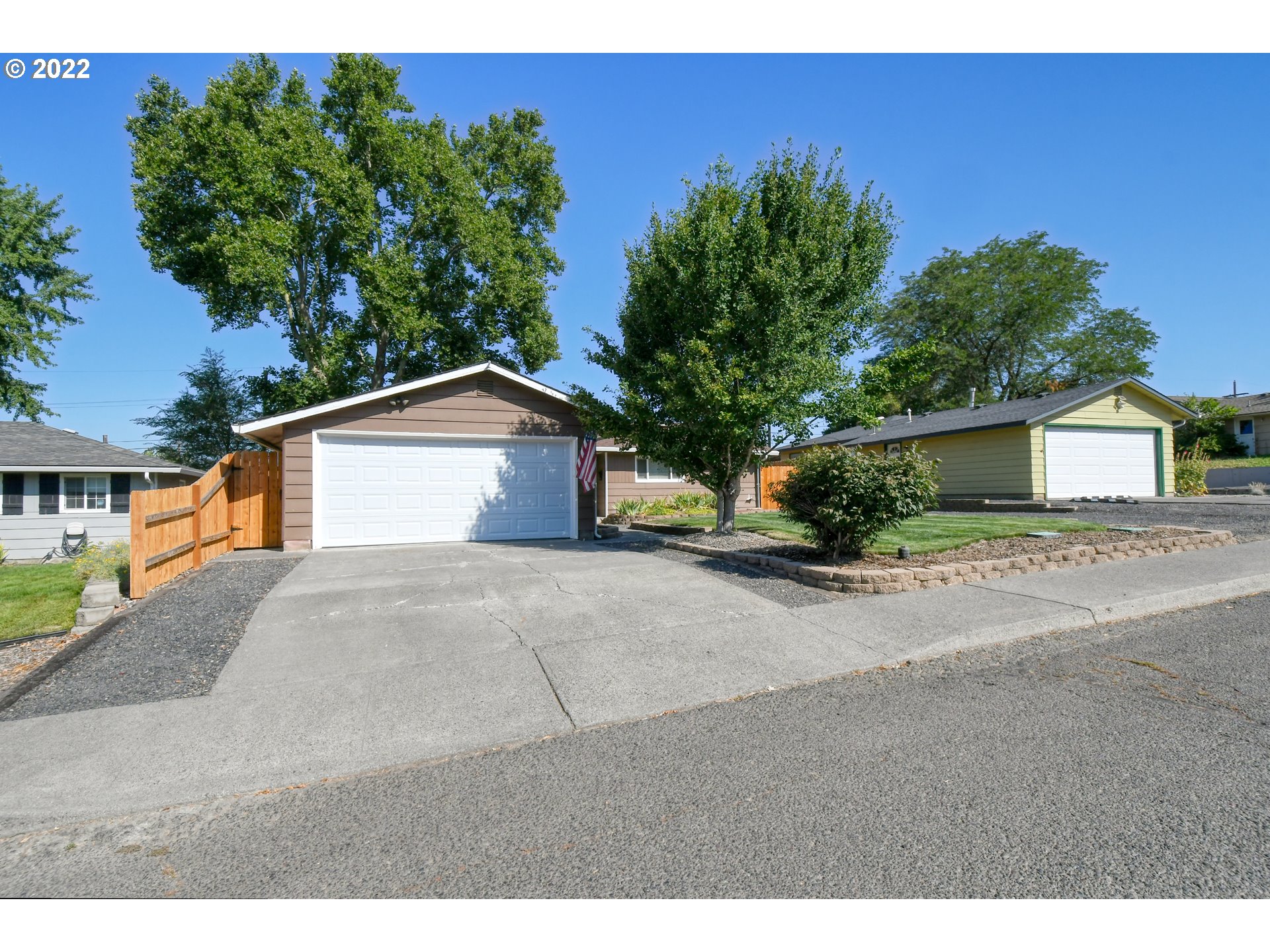 3123 Southwest Isaac Avenue Pendleton, OR 97801 - Photo 3 of 32 a view of a house with a yard and garage
