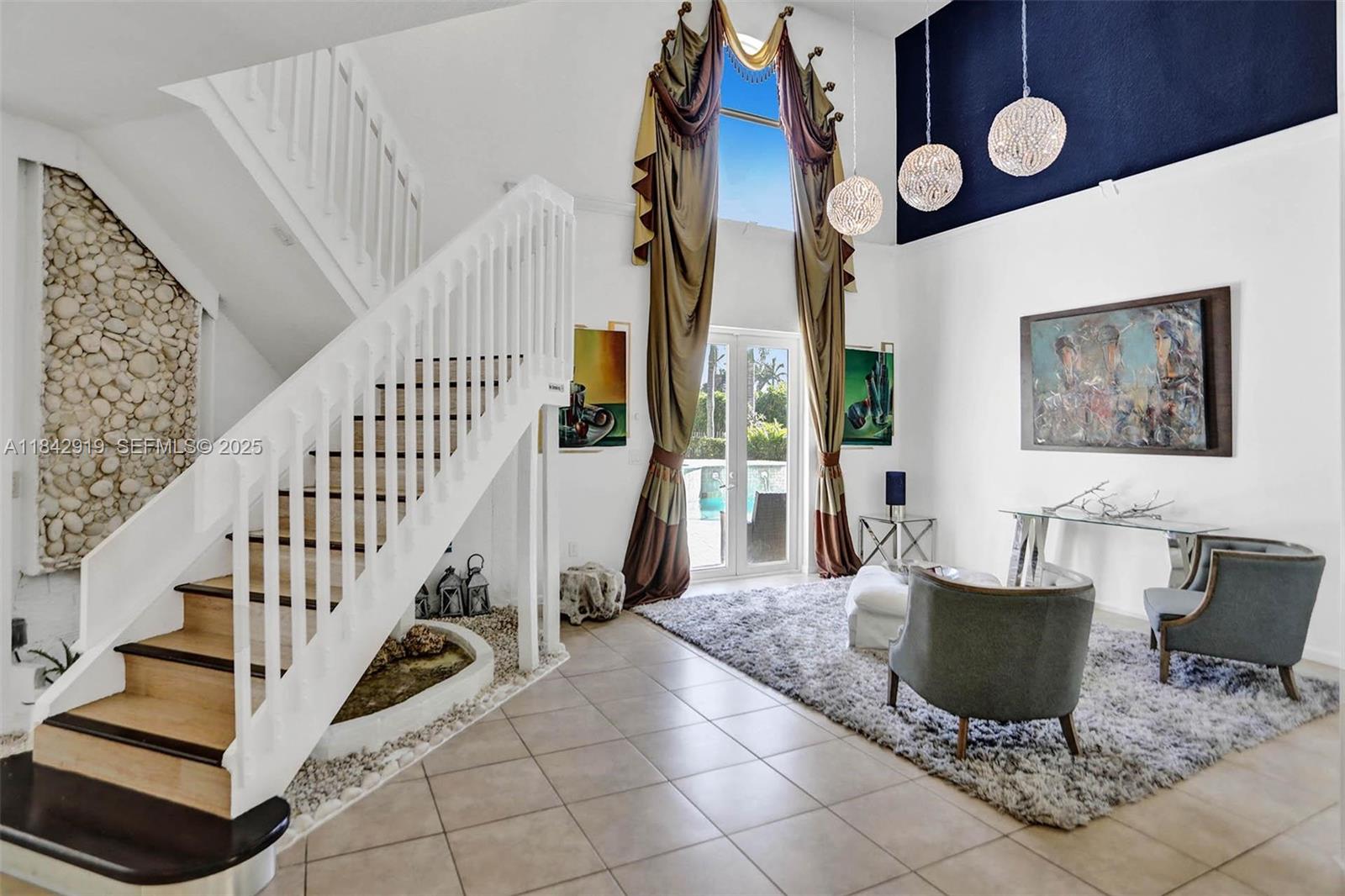 721 Ranch Road Weston, FL 33326 - Photo 31 of 38 a view of a livingroom with furniture and staircase
