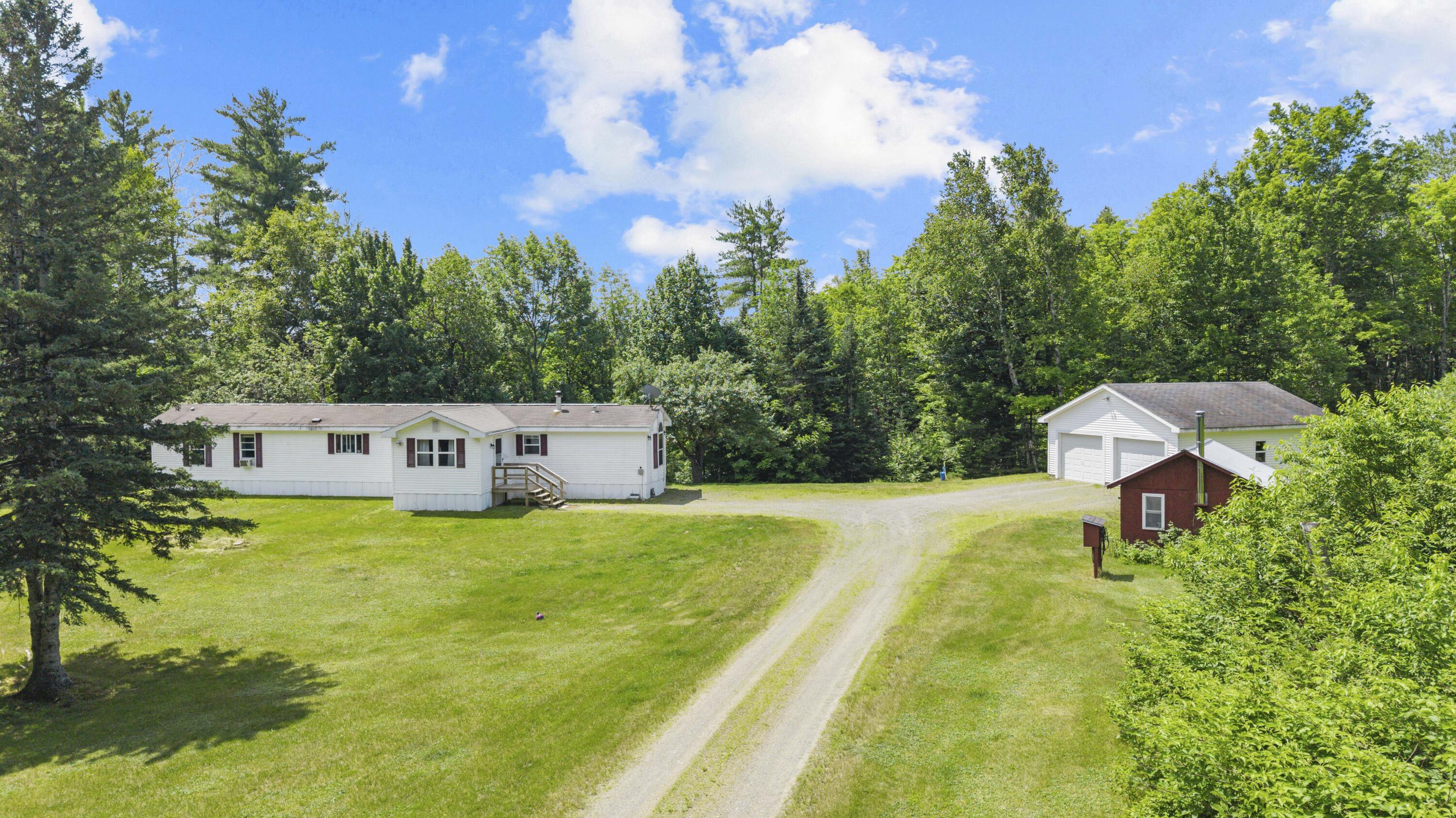 801 Reed's Mill Road Madrid Township, ME 04966 - Photo 1 of 28 DJI_20260717113712_0309_D