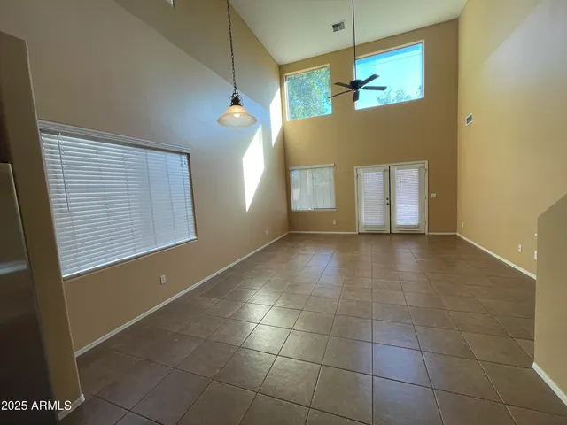 a kitchen with stainless steel appliances granite countertop a refrigerator a stove and a sink