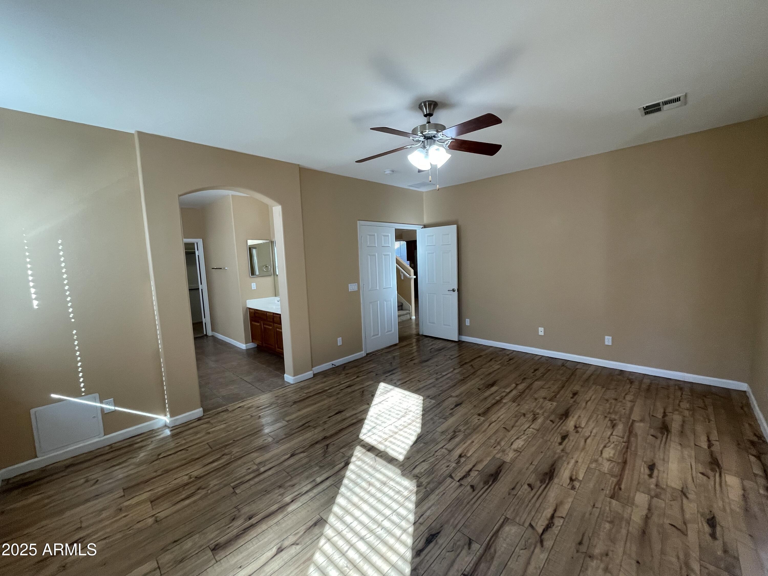 1441 East Thornton Avenue Gilbert, AZ 85297 - Photo 8 of 13 a view of an empty room with wooden floor
