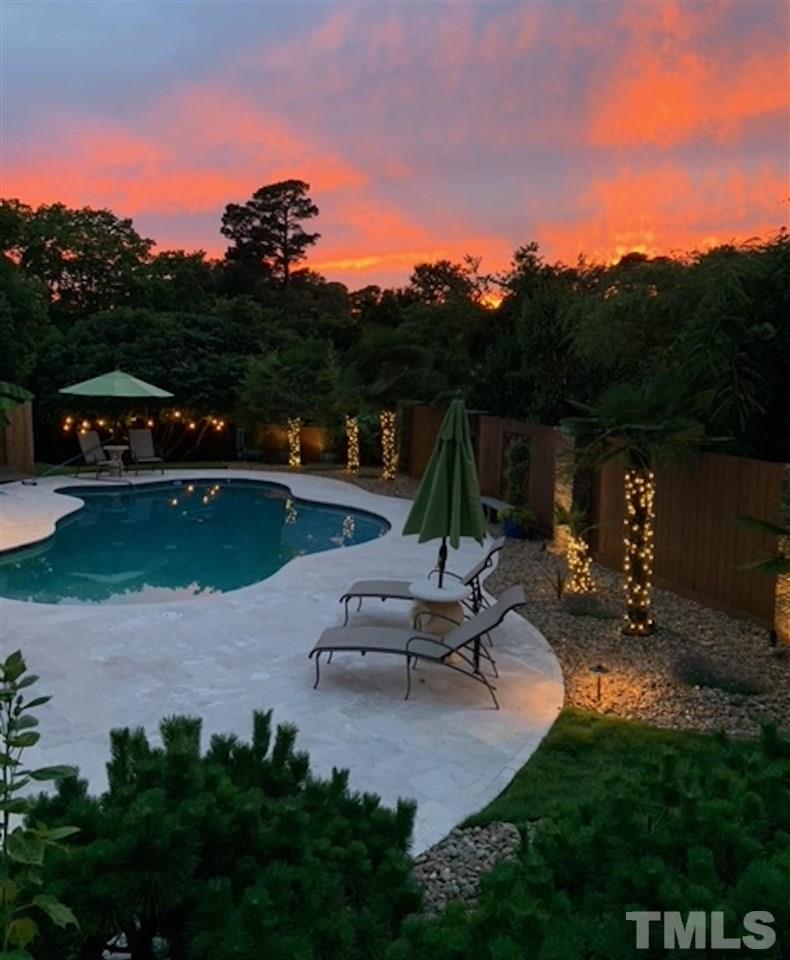 4028 John S Raboteau Wynd Raleigh, NC 27612 - Photo 2 of 30 a view of a swimming pool with a patio