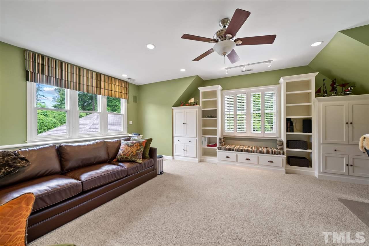 4028 John S Raboteau Wynd Raleigh, NC 27612 - Photo 22 of 30 a living room with furniture and windows