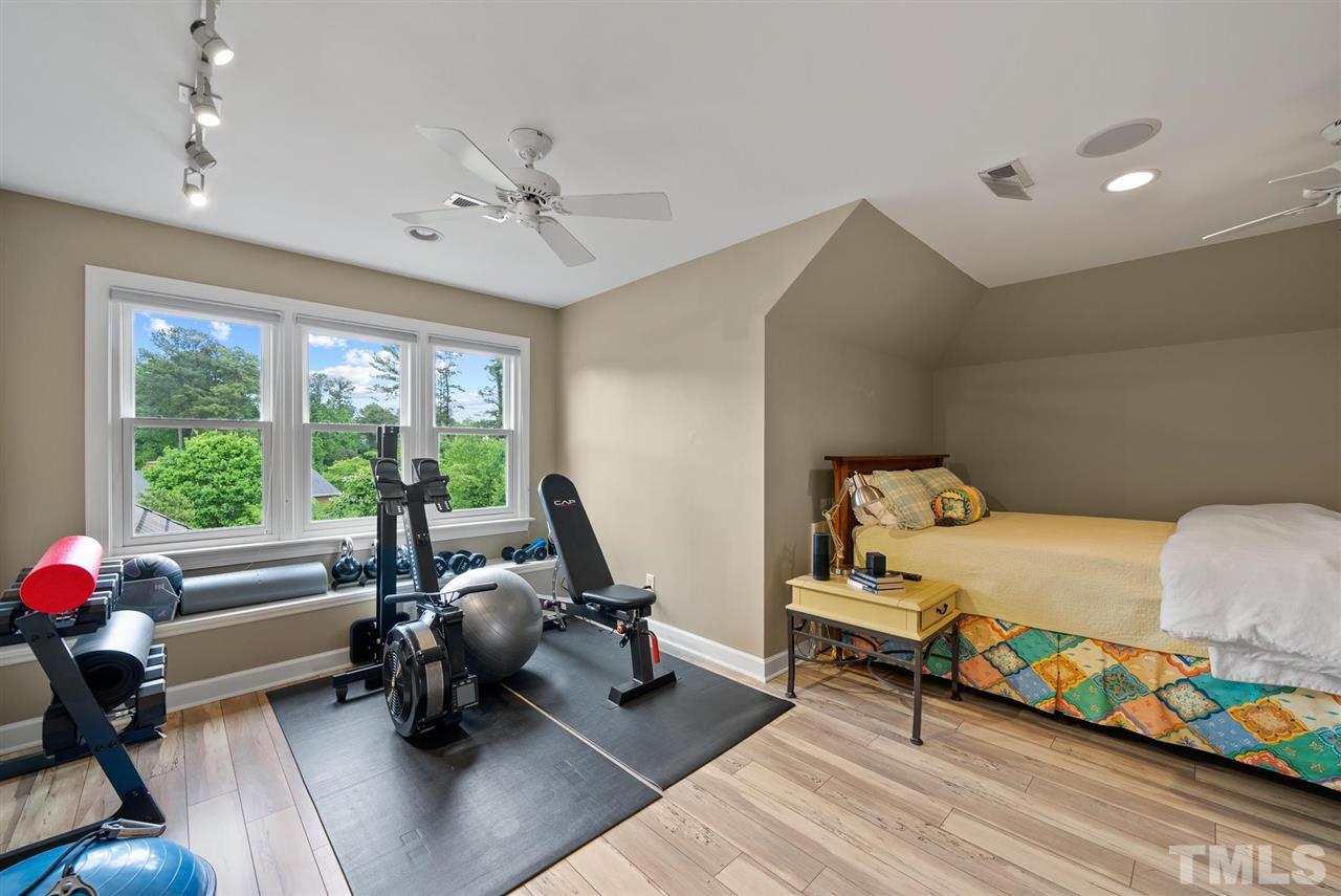 4028 John S Raboteau Wynd Raleigh, NC 27612 - Photo 23 of 30 a bedroom with furniture and a large window