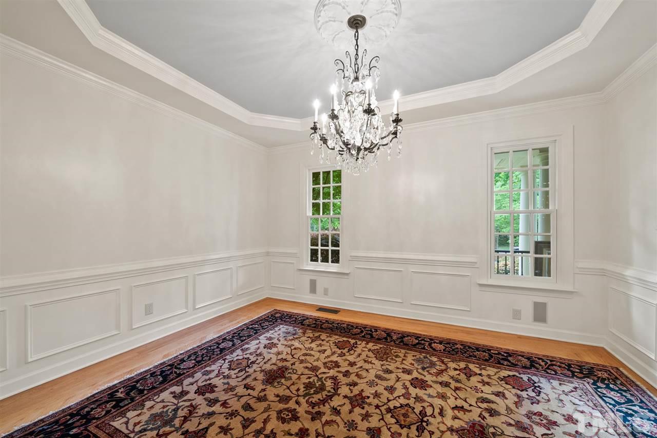 4028 John S Raboteau Wynd Raleigh, NC 27612 - Photo 4 of 30 wooden floor in an empty room with a window
