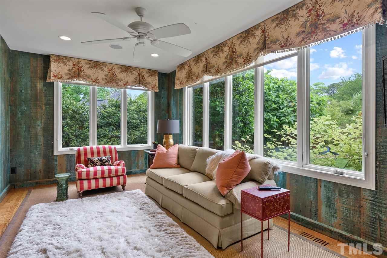 4028 John S Raboteau Wynd Raleigh, NC 27612 - Photo 7 of 30 a living room with furniture and a large window