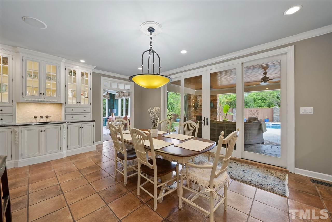 4028 John S Raboteau Wynd Raleigh, NC 27612 - Photo 8 of 30 a view of a dining room with furniture window and outside view