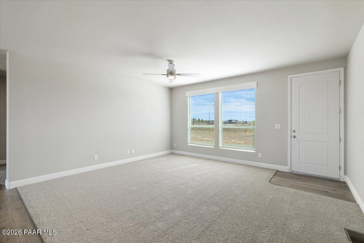 7366 East Bunkhouse Road Prescott Valley, AZ 86315 - Photo 16 of 25 a view of an empty room with a window