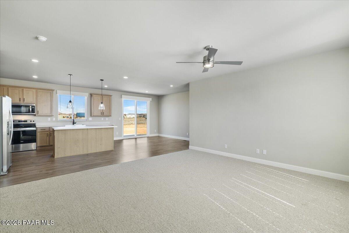 7366 East Bunkhouse Road Prescott Valley, AZ 86315 - Photo 17 of 25 a view of kitchen with kitchen island a sink stainless steel appliances and cabinets