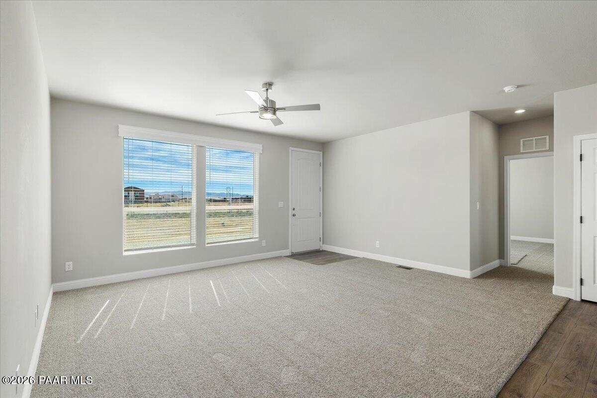 7366 East Bunkhouse Road Prescott Valley, AZ 86315 - Photo 18 of 25 a view of an empty room with a window