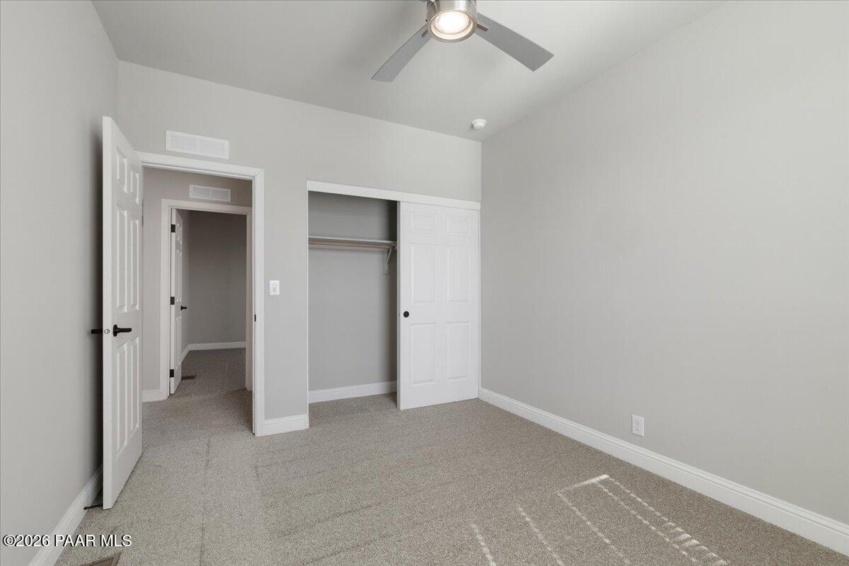 7366 East Bunkhouse Road Prescott Valley, AZ 86315 - Photo 22 of 25 a view of an empty room with a bathroom