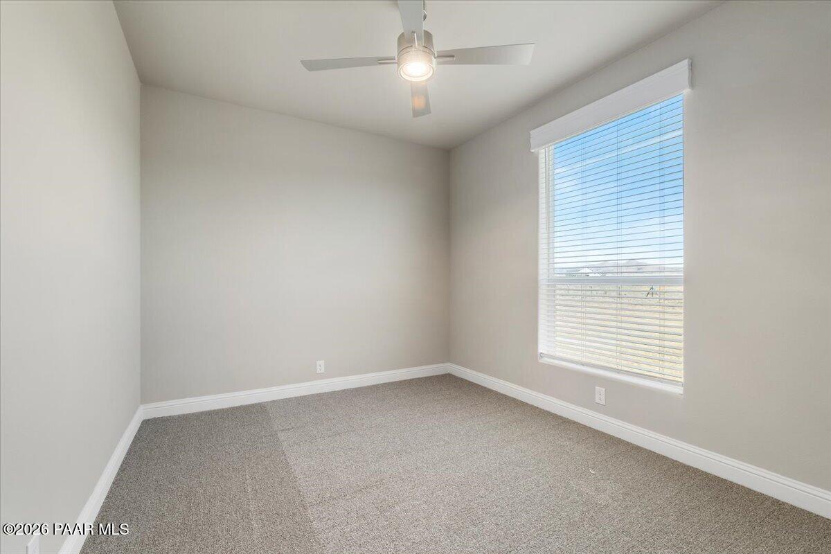 7366 East Bunkhouse Road Prescott Valley, AZ 86315 - Photo 23 of 25 an empty room with a window