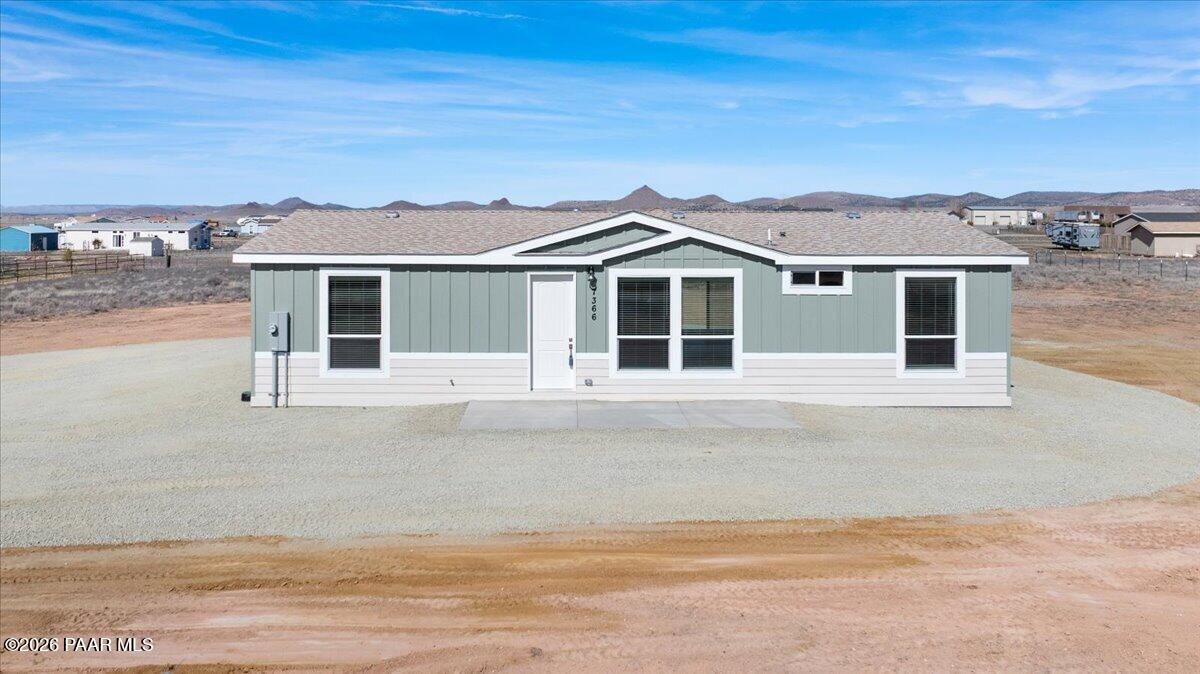 7366 East Bunkhouse Road Prescott Valley, AZ 86315 - Photo 5 of 25 front view of a house with a yard