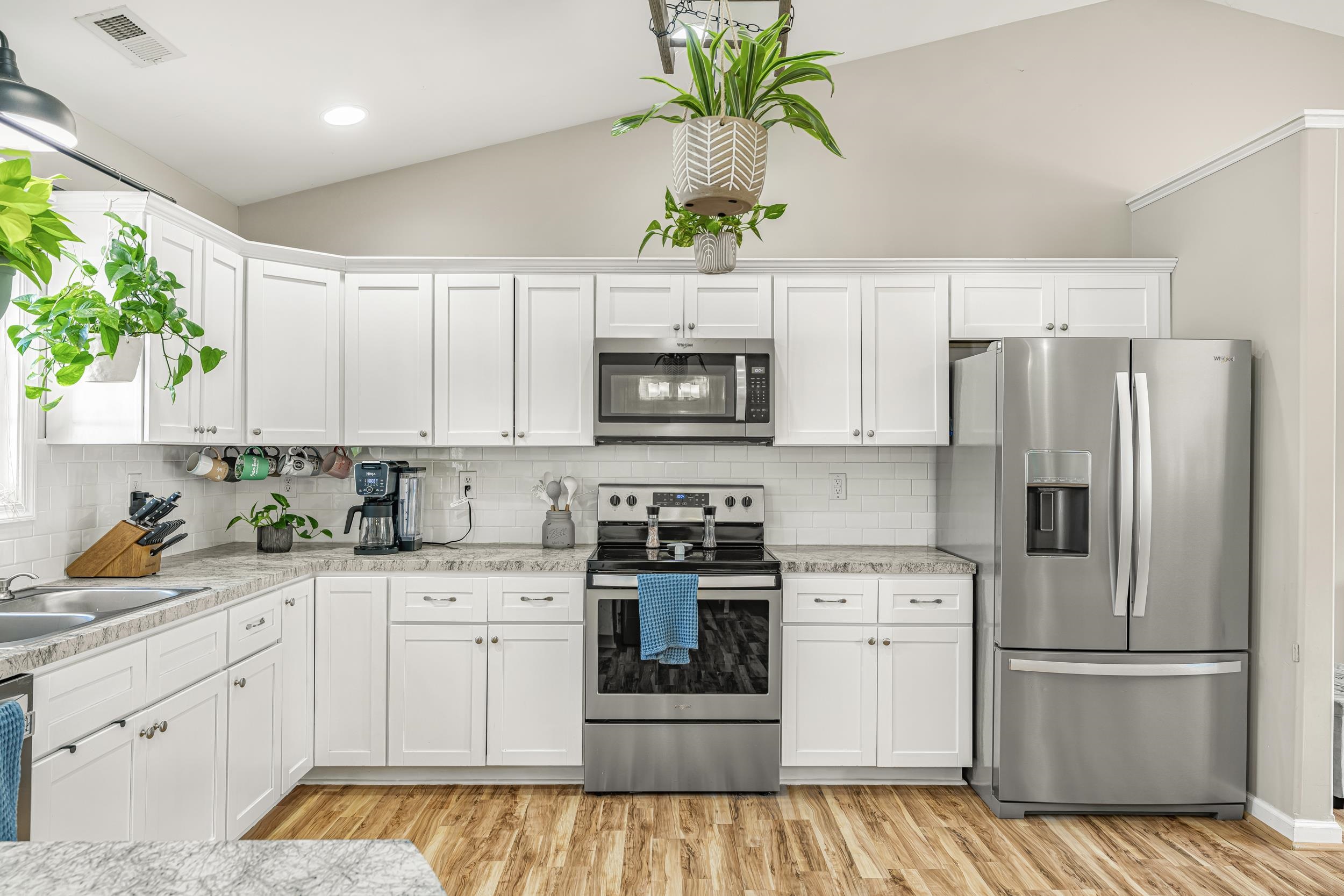 96 Lofty Circle Stuarts Draft, VA 24477 - Photo 15 of 69 a kitchen with granite countertop white cabinets and white appliances