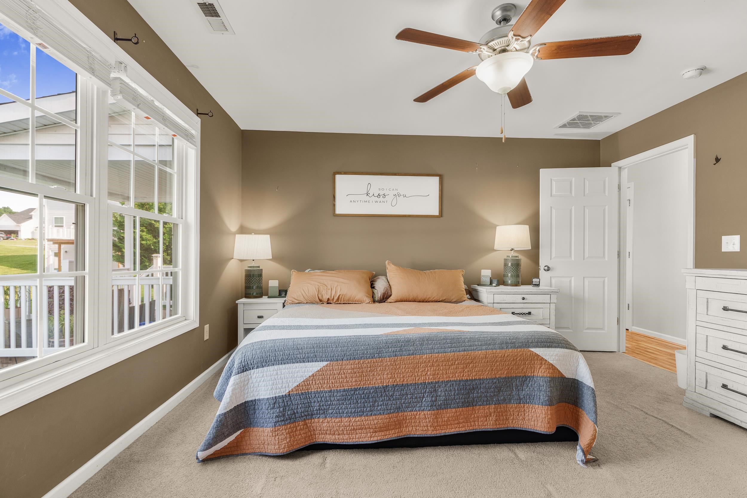 96 Lofty Circle Stuarts Draft, VA 24477 - Photo 21 of 69 a bedroom with a bed and a chandelier