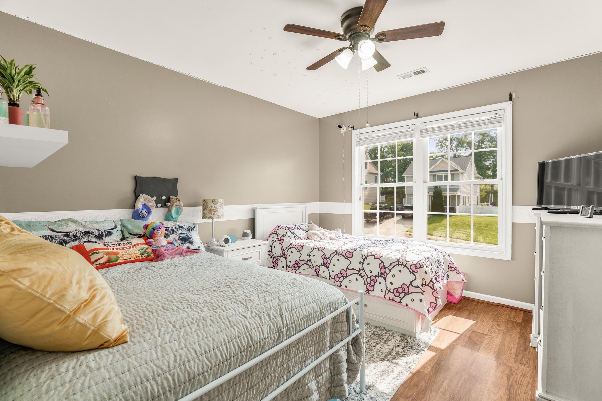 96 Lofty Circle Stuarts Draft, VA 24477 - Photo 26 of 69 a bedroom with two beds and a large window
