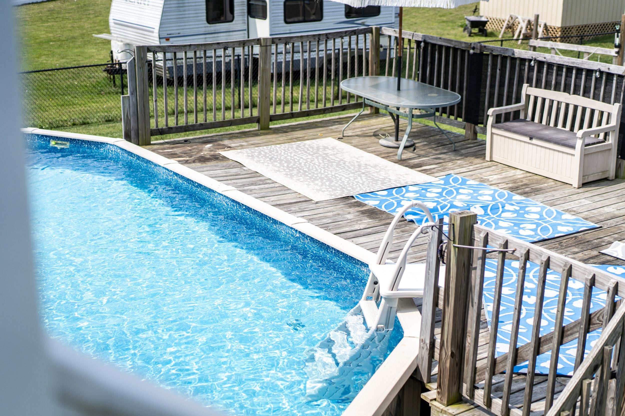 96 Lofty Circle Stuarts Draft, VA 24477 - Photo 47 of 69 a view of a deck with a chair and swing