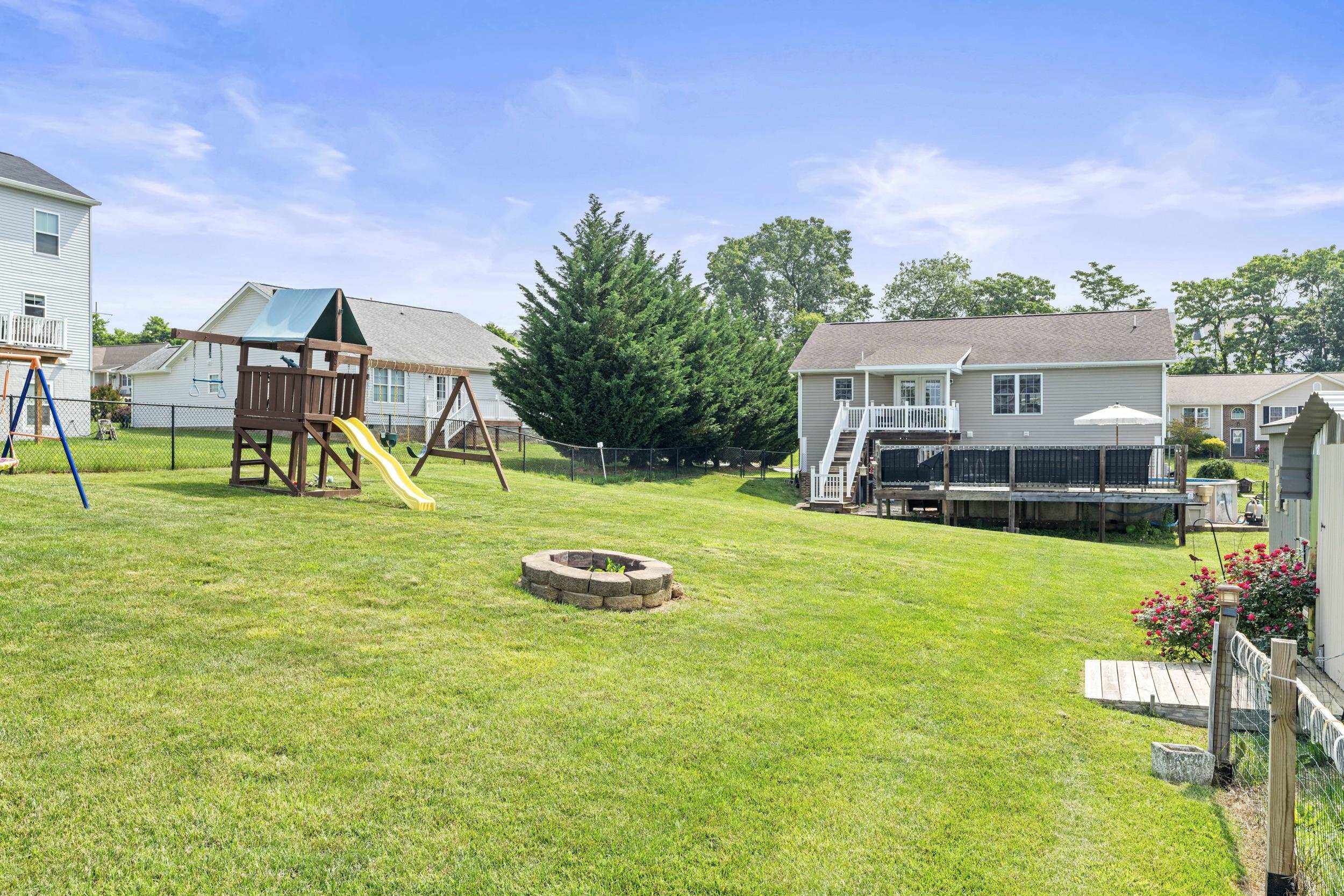 96 Lofty Circle Stuarts Draft, VA 24477 - Photo 51 of 69 a view of a house with a big yard and sitting area