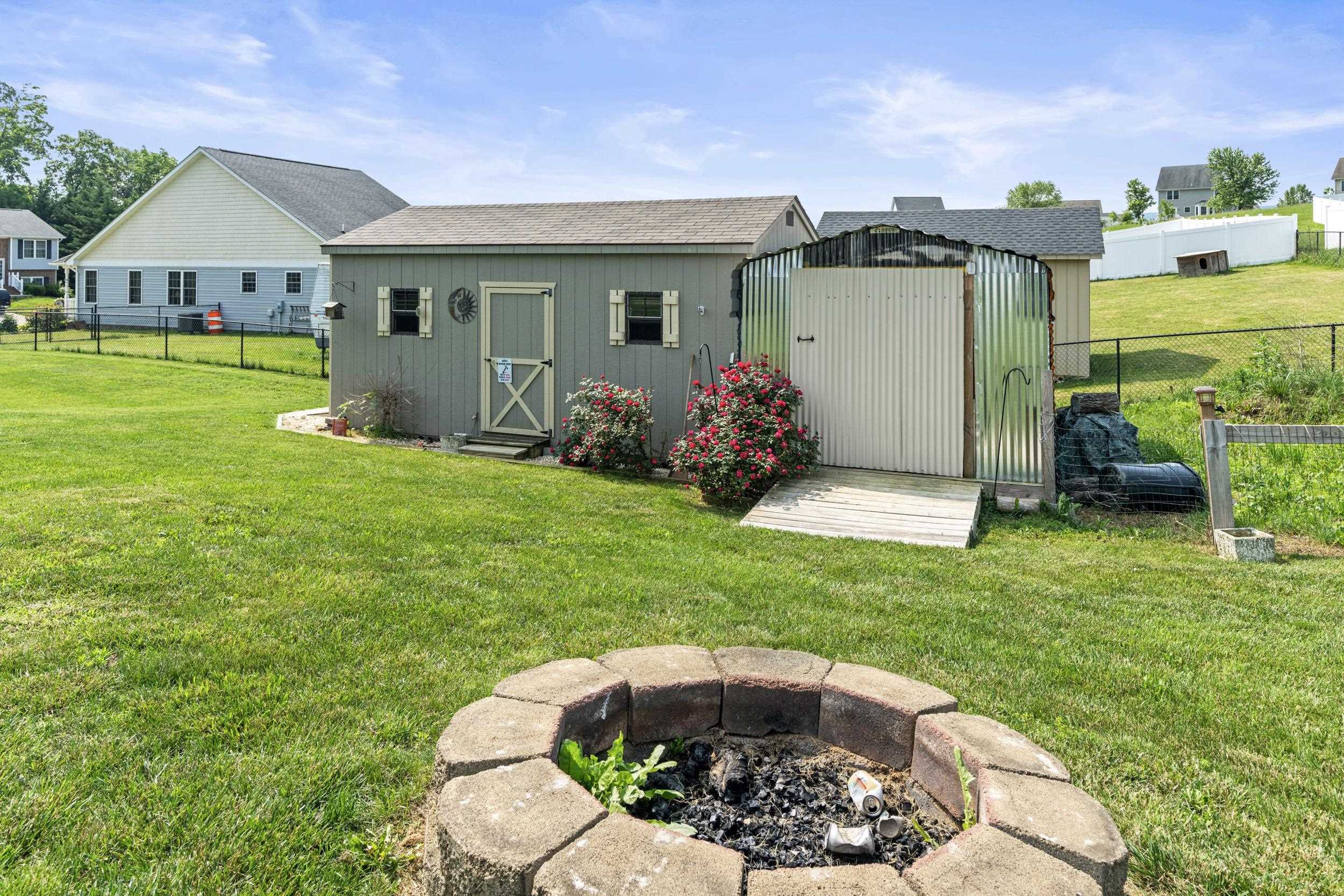 96 Lofty Circle Stuarts Draft, VA 24477 - Photo 52 of 69 a view of a house with backyard sitting area and garden