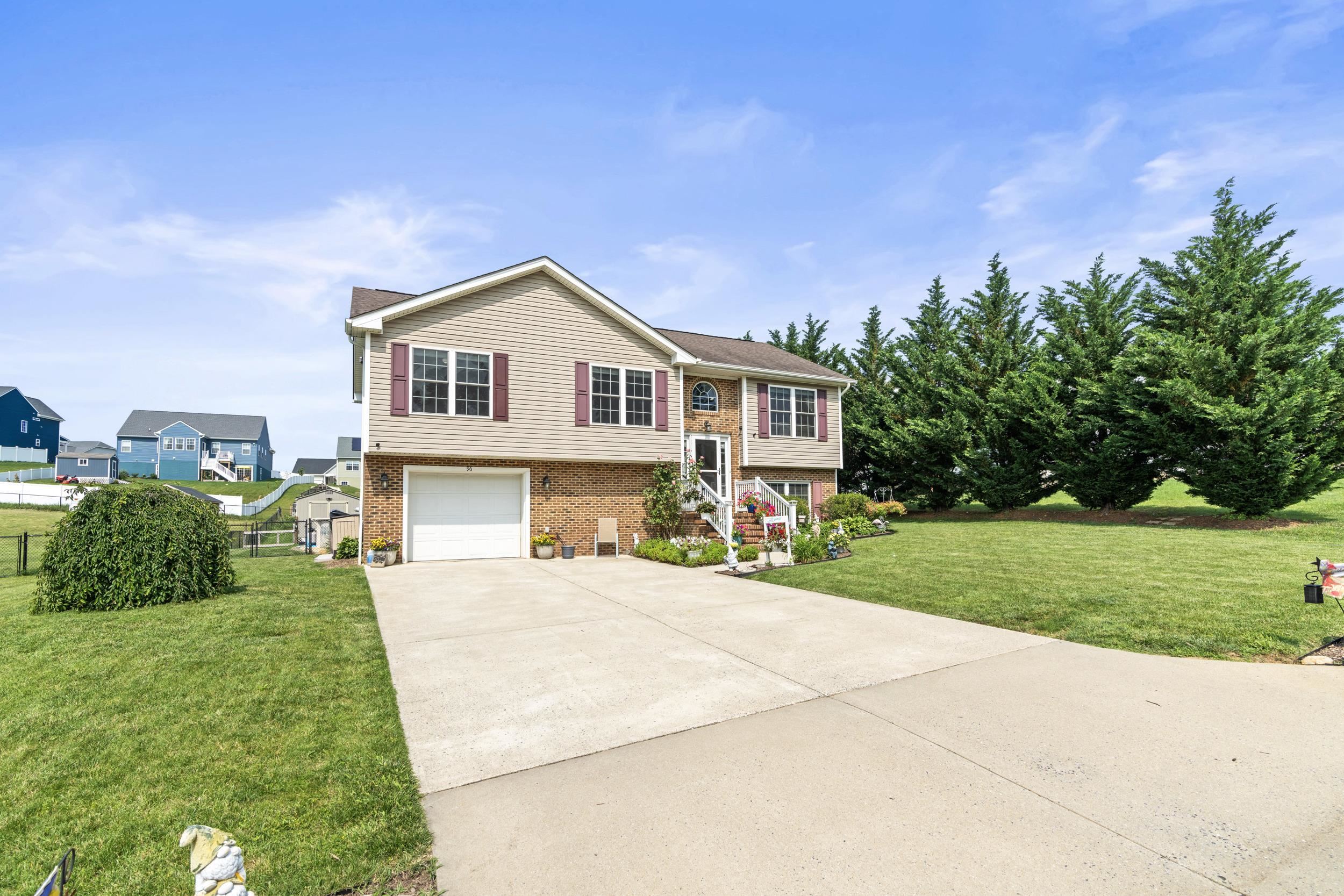 96 Lofty Circle Stuarts Draft, VA 24477 - Photo 57 of 69 a front view of a house with a yard and garage
