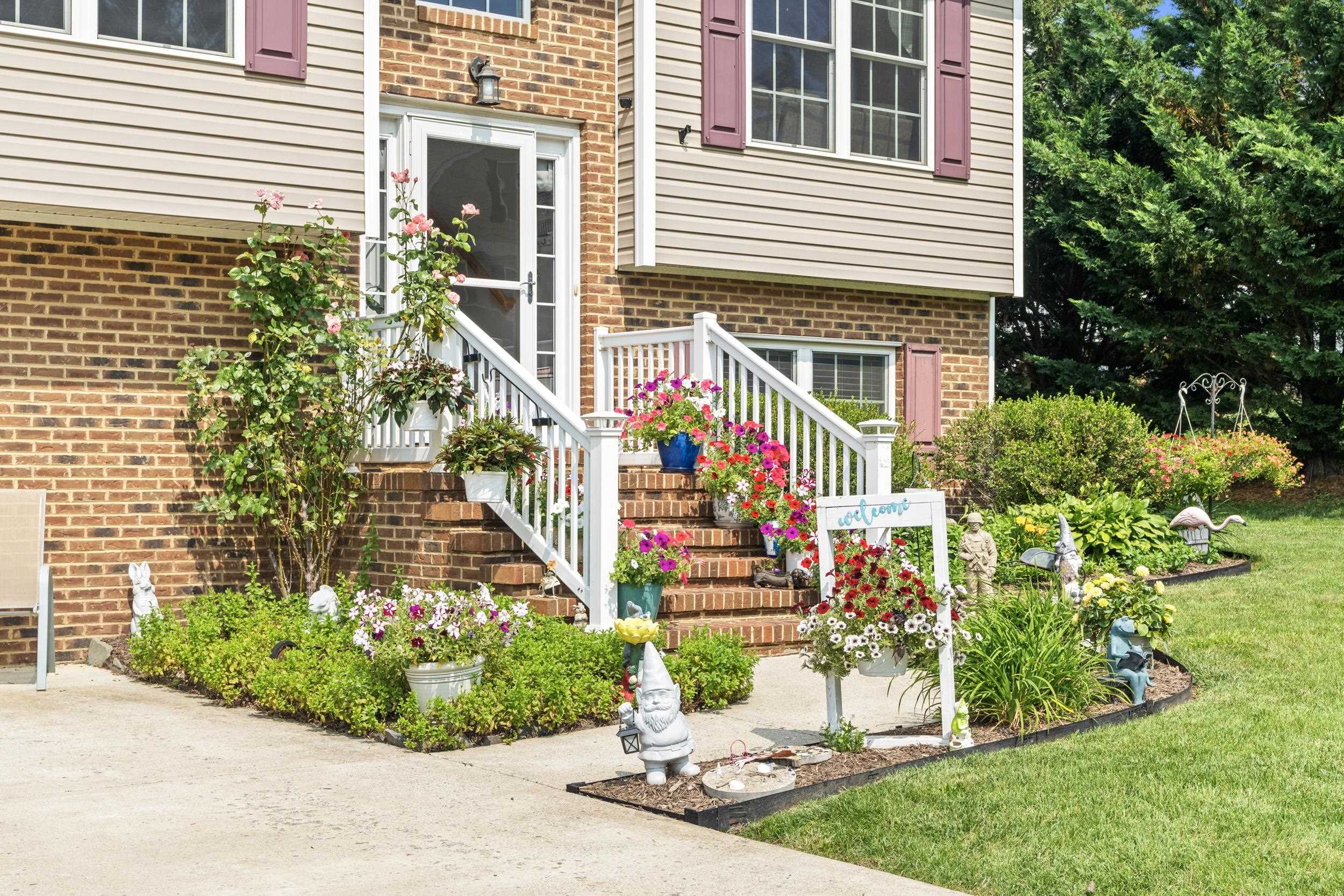 96 Lofty Circle Stuarts Draft, VA 24477 - Photo 6 of 69 a front view of a house with a yard and outdoor seating