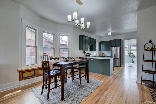 a kitchen with stainless steel appliances a refrigerator sink and stove