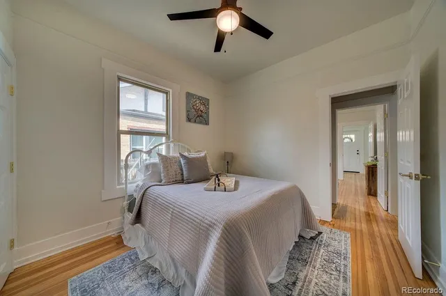 a room with two beds and painted walls