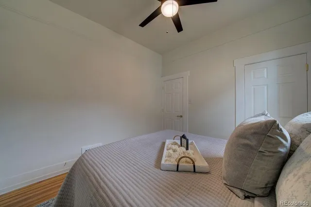 a bathroom with a sink vanity granite tub shower and a mirror