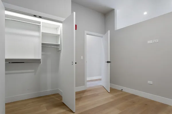 a kitchen with kitchen island a sink appliances and cabinets